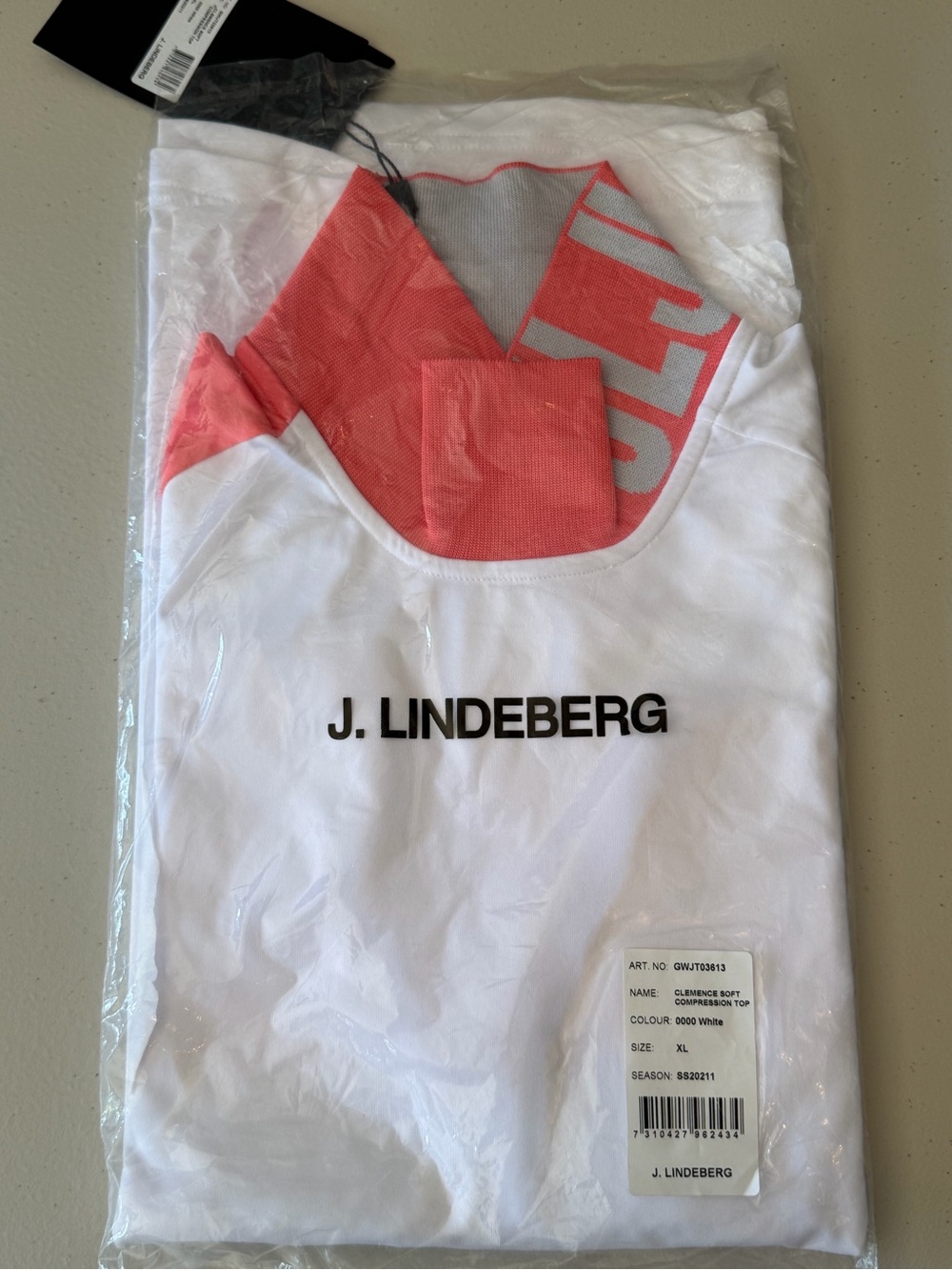 J.Lindeberg White Tee UV soft compression with Coral Neck Detail